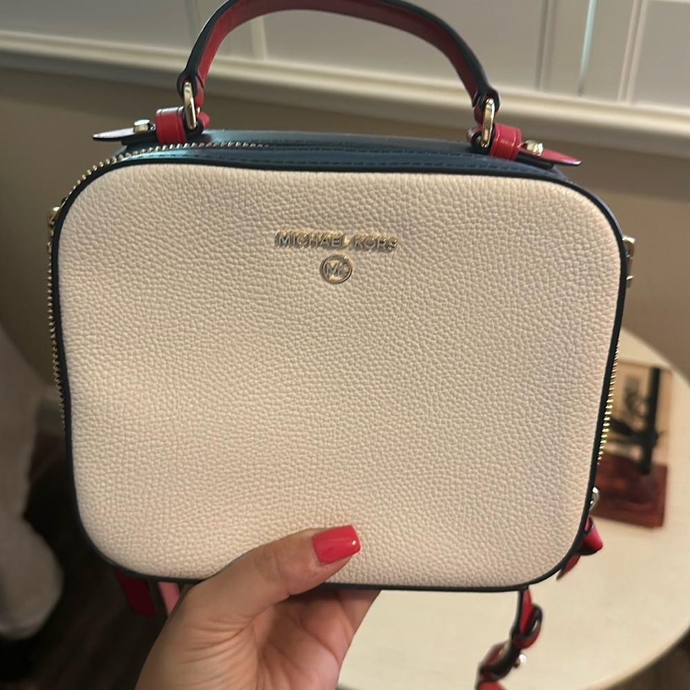 Michael Kors Off White with Red and Blue Trim all leather.